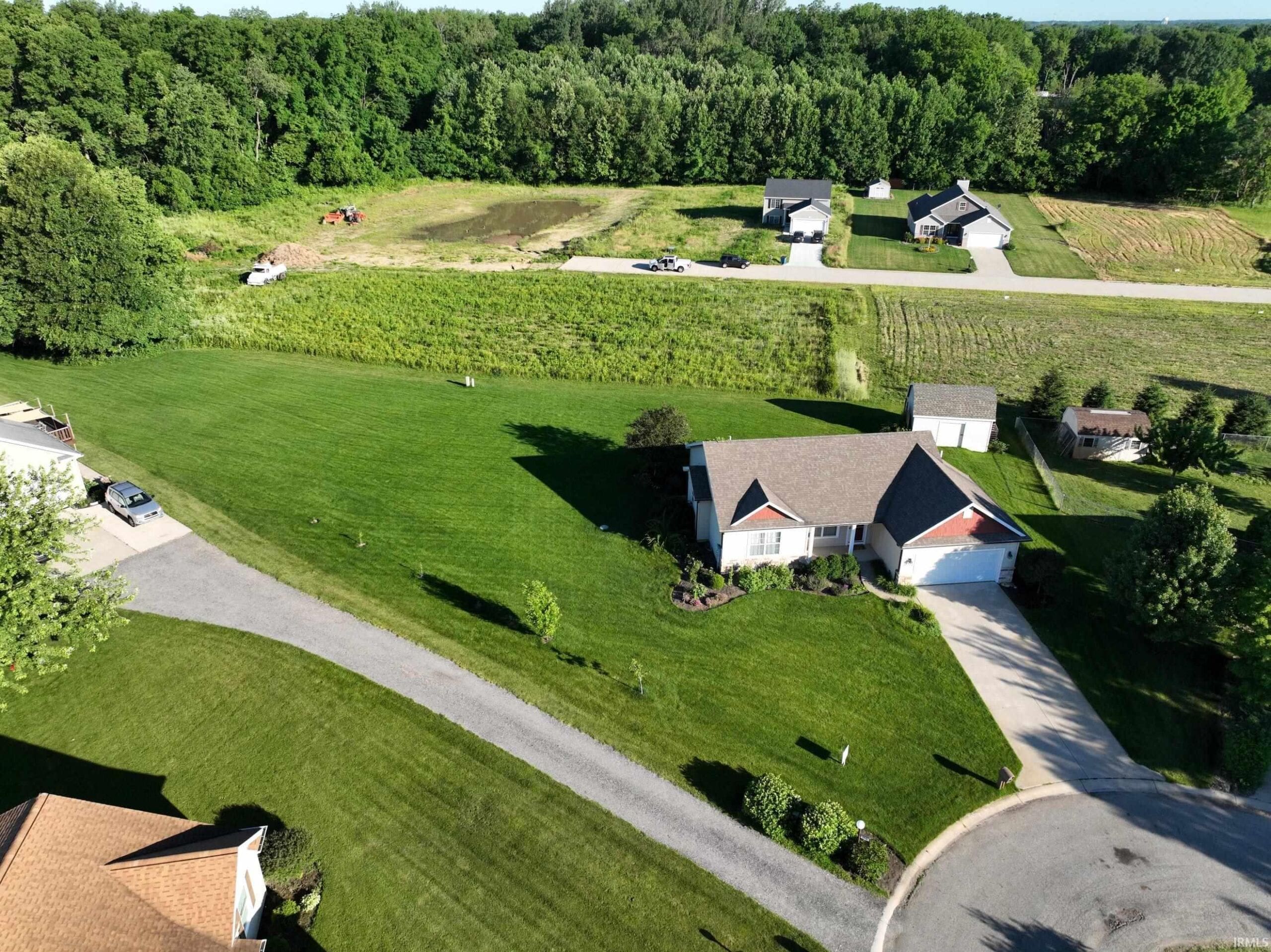 Overhead view of buildable lot and surrounding homes in quiet Plymouth, IN neighborhood.